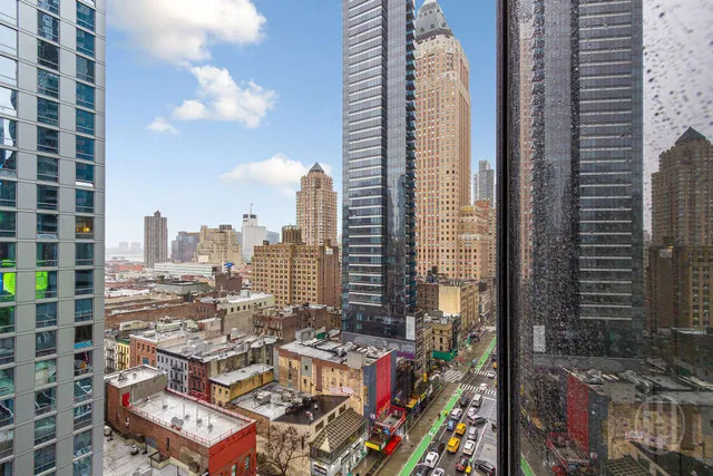 a living room with furniture pool table wooden floor and windows