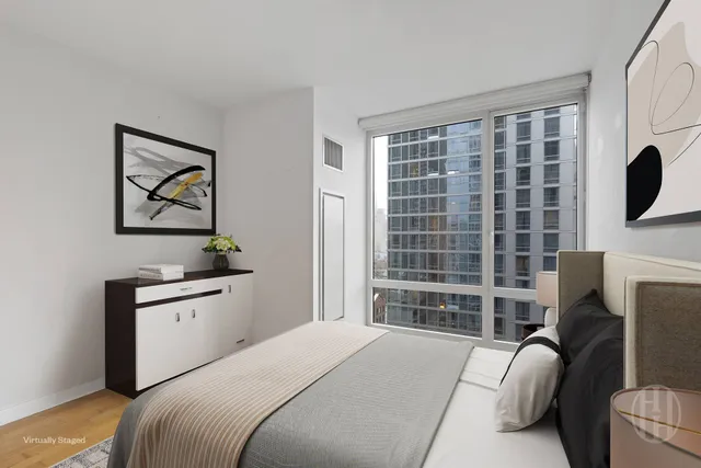 a large kitchen with a refrigerator and a sink