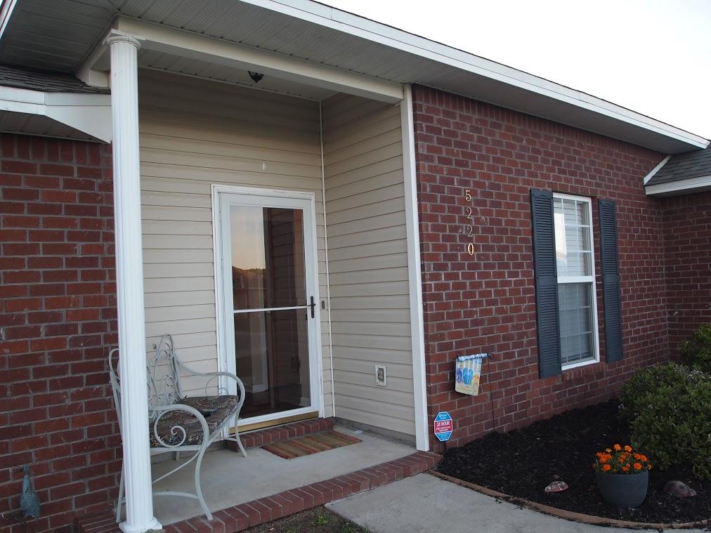 5220 Moore Loop Crestview, FL 32536 - Photo 18 of 24 a brick building with a potted plant on it