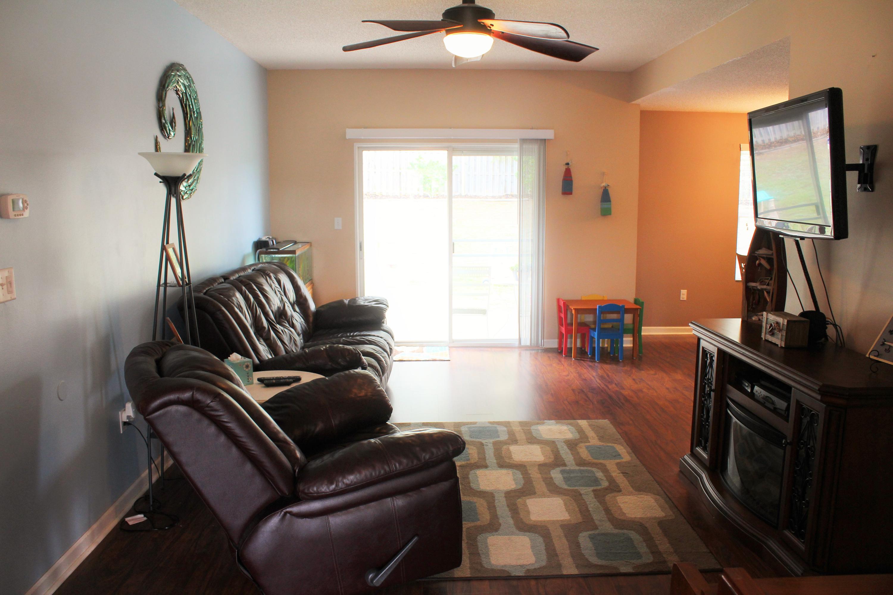 5220 Moore Loop Crestview, FL 32536 - Photo 3 of 24 a living room with furniture and a flat screen tv