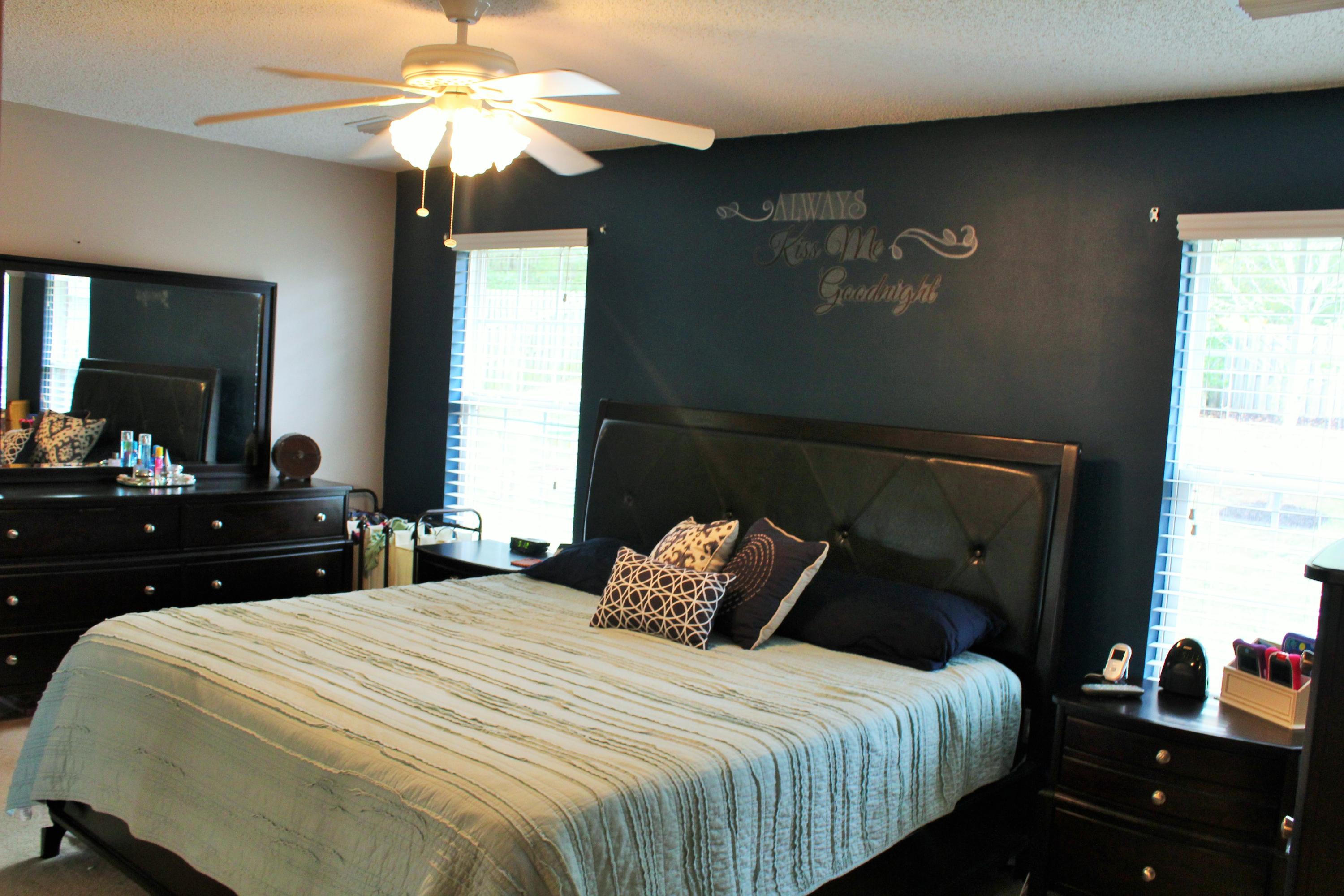 5220 Moore Loop Crestview, FL 32536 - Photo 6 of 24 a bedroom with a bed and a chandelier