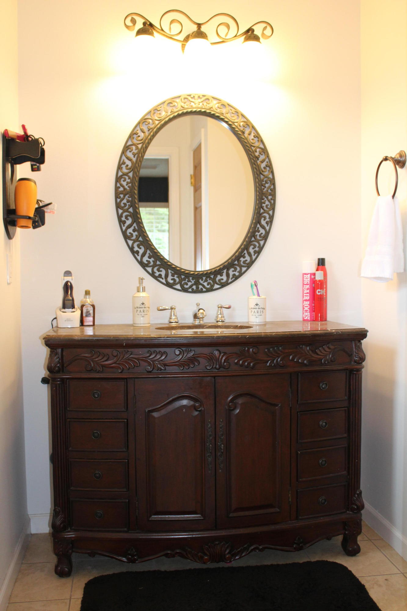 5220 Moore Loop Crestview, FL 32536 - Photo 7 of 24 a bathroom with a sink and a mirror