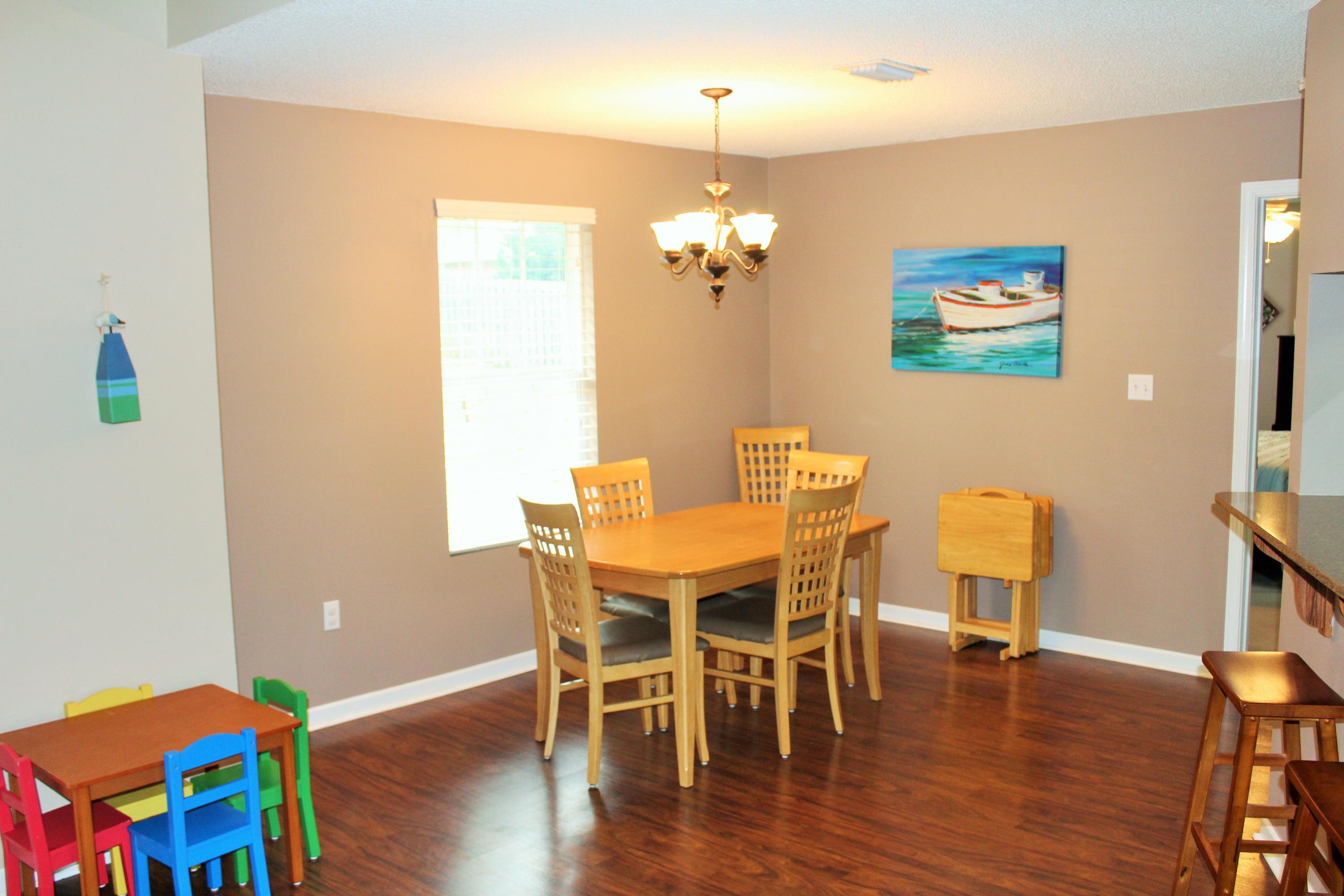 5220 Moore Loop Crestview, FL 32536 - Photo 8 of 24 a view of a dining room with furniture and wooden floor