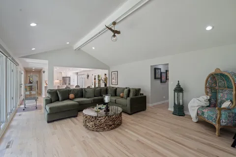 a dining room with furniture and window