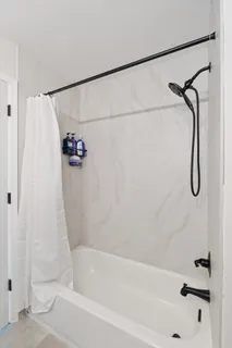 a kitchen with sink and refrigerator