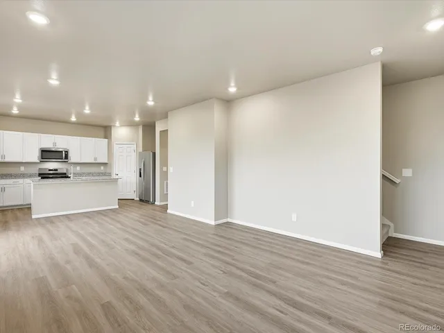 a view of kitchen with wooden floor