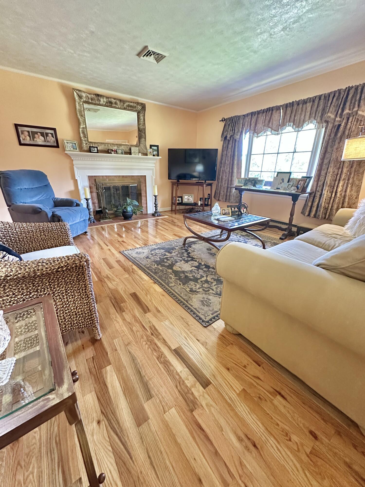 4801 Nicelytown Road Clifton Forge, VA 24422 - Photo 27 of 96 a living room with furniture fireplace and flat screen tv