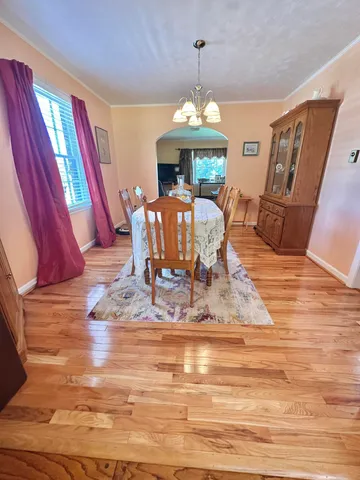 a view of balcony with wooden floor and fence