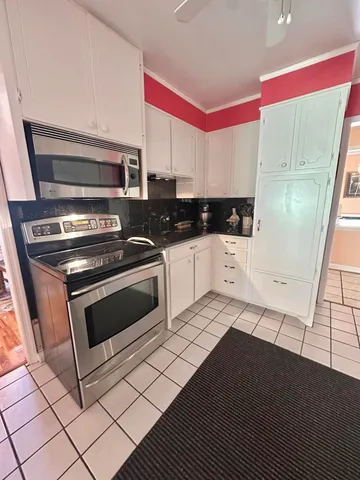 a view of a room with a bed and a fireplace