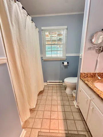 an aerial view of a house with swimming pool garden and patio