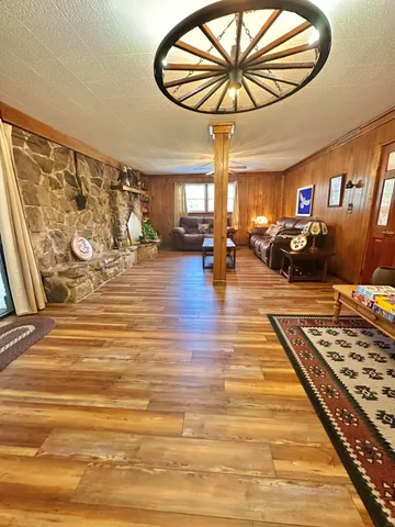 an aerial view of a house with a yard basket ball court and outdoor seating