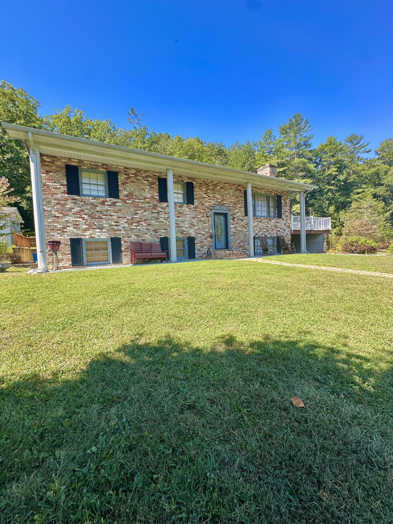 4801 Nicelytown Road Clifton Forge, VA 24422 - Photo 6 of 96 a view of a house with a big yard and large trees