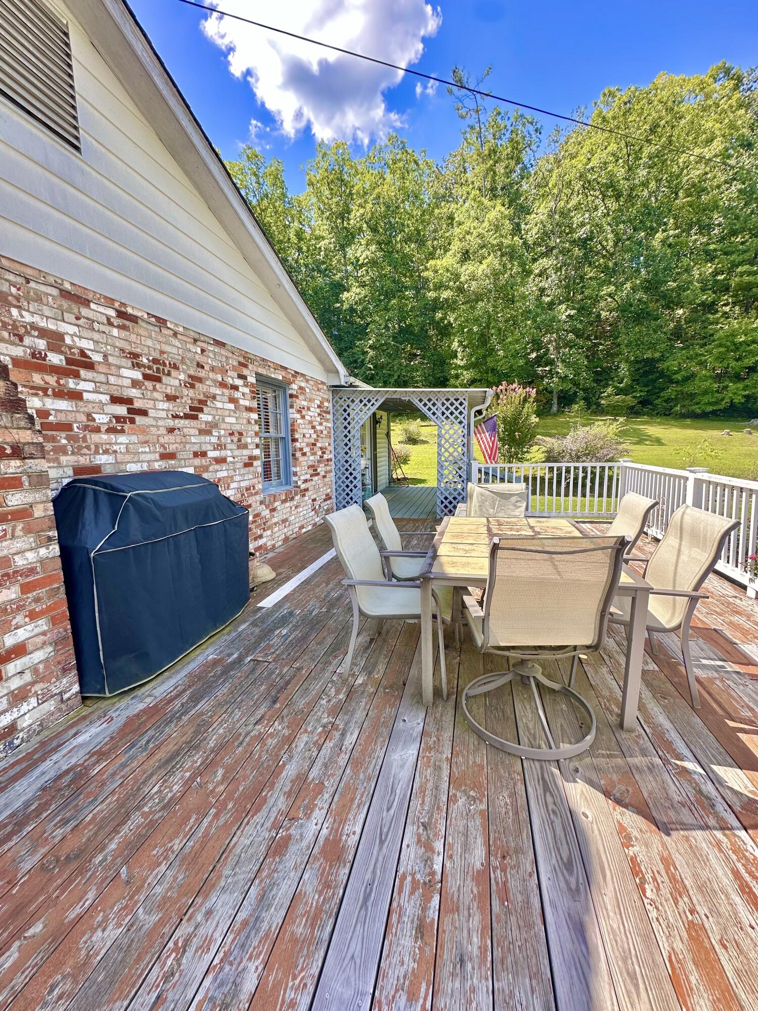 4801 Nicelytown Road Clifton Forge, VA 24422 - Photo 67 of 96 a balcony with wooden floor table and chairs