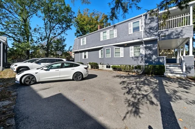 a view of a car parked in front of a house