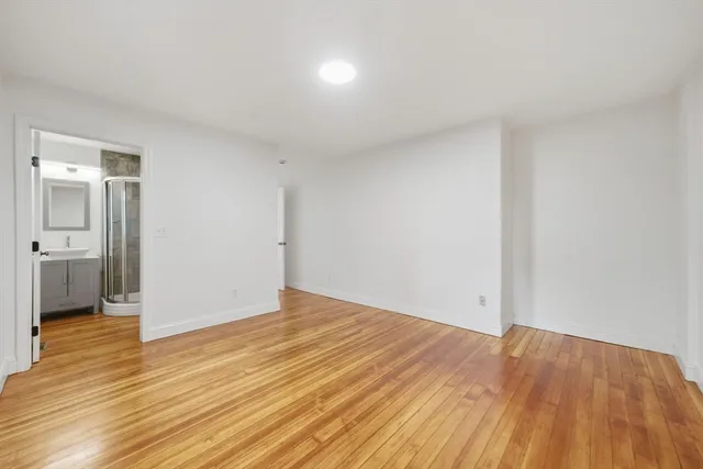 a view of an empty room and glass door