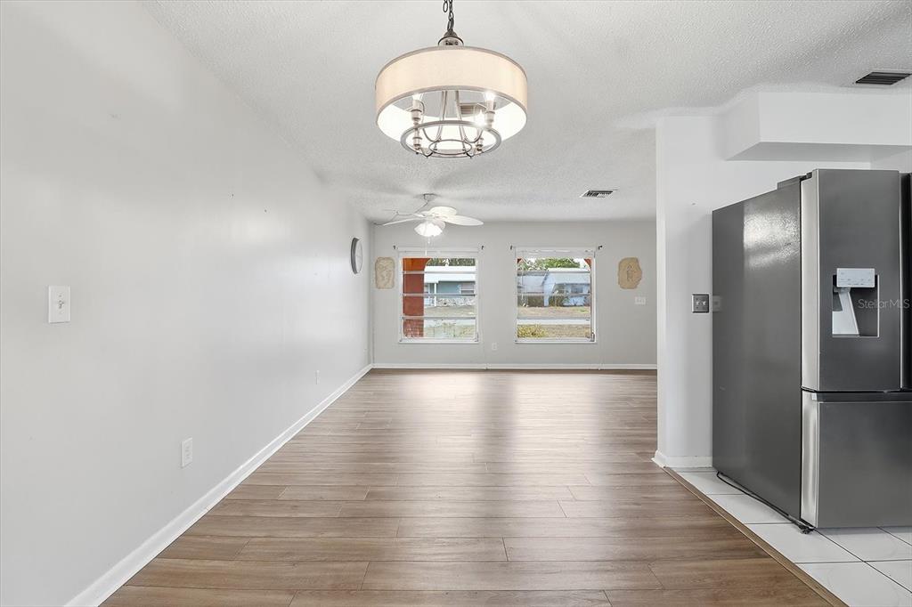 2341 South Whitier Point Homosassa, FL 34448 - Photo 12 of 36 a view of an empty room with window and wooden floor