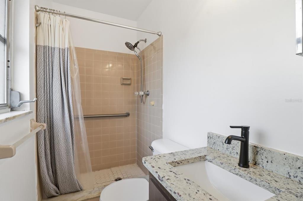 2341 South Whitier Point Homosassa, FL 34448 - Photo 21 of 36 a bathroom with a granite countertop sink toilet and shower