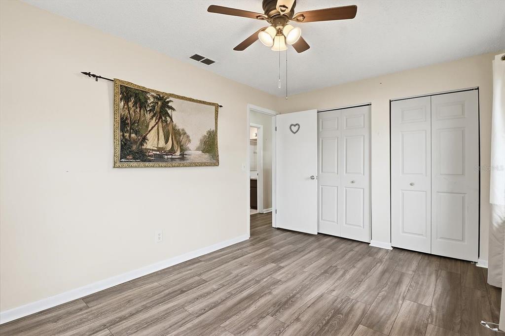 2341 South Whitier Point Homosassa, FL 34448 - Photo 23 of 36 a view of a hallway with wooden floor and closet area