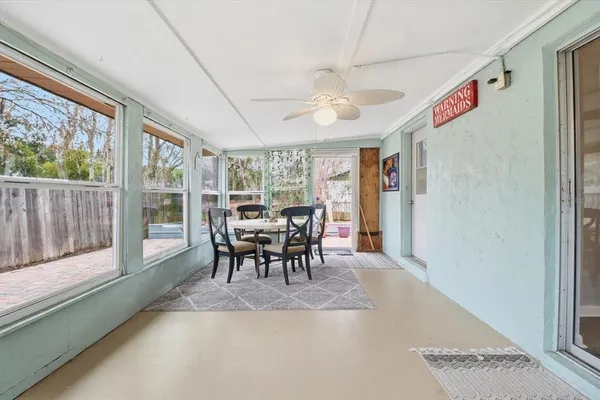 a view of a dining room with furniture window and outside view