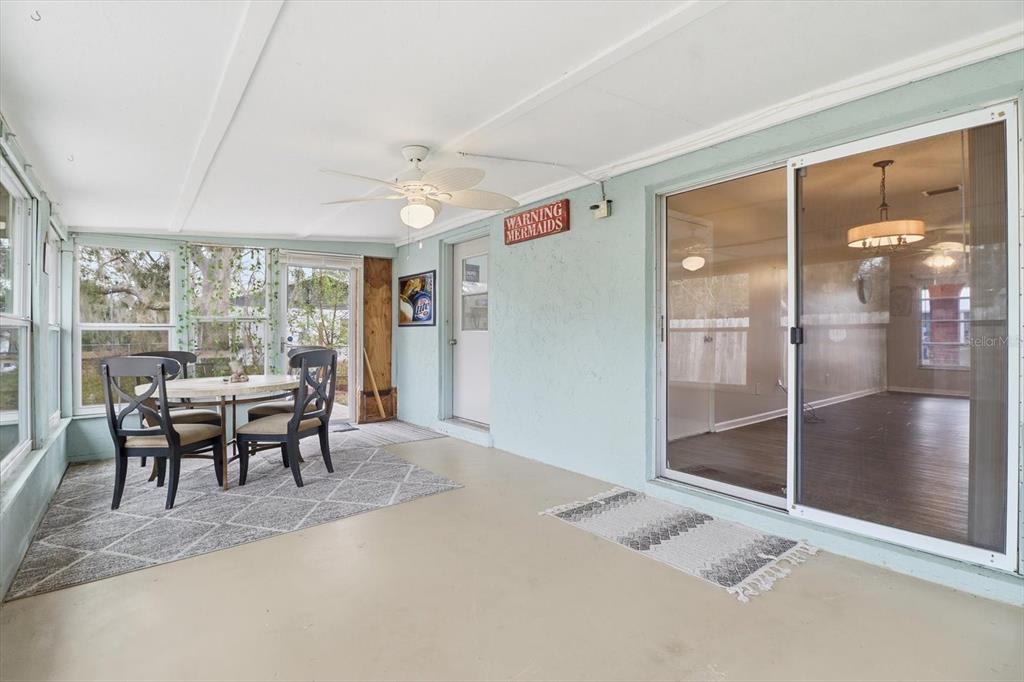 2341 South Whitier Point Homosassa, FL 34448 - Photo 29 of 36 a dining room with furniture and a floor to ceiling window