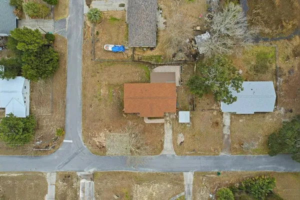 an aerial view of a house with outdoor space