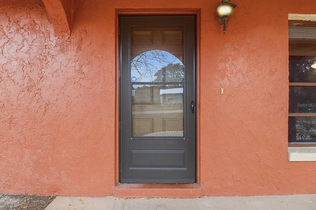 2341 South Whitier Point Homosassa, FL 34448 - Photo 6 of 36 a glass door with a glass door