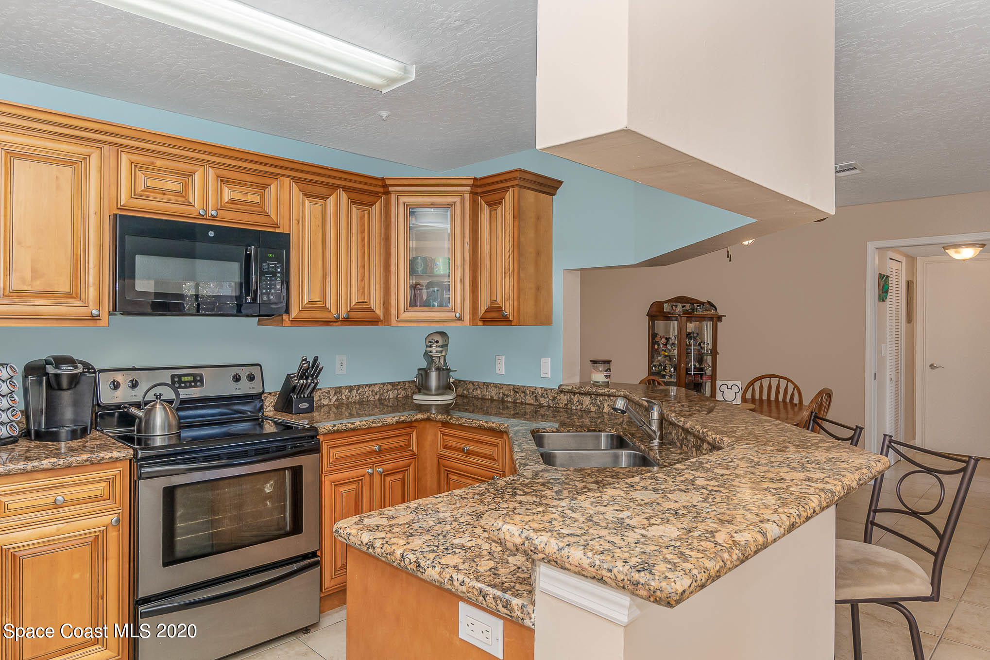 7667 North Wickham Road, Unit 914 Melbourne, FL 32940 - Photo 3 of 29 Updated Kitchen with Breakfast Bar