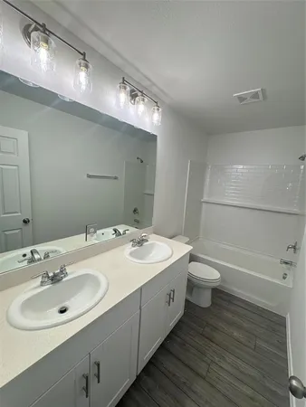 a bathroom with a sink and mirror