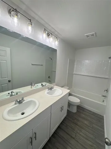 a bathroom with a sink and mirror