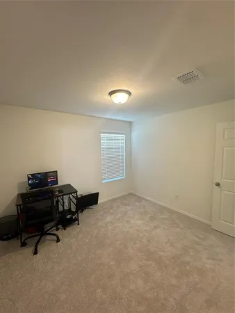 a view of a big room with wooden floor and air conditioner