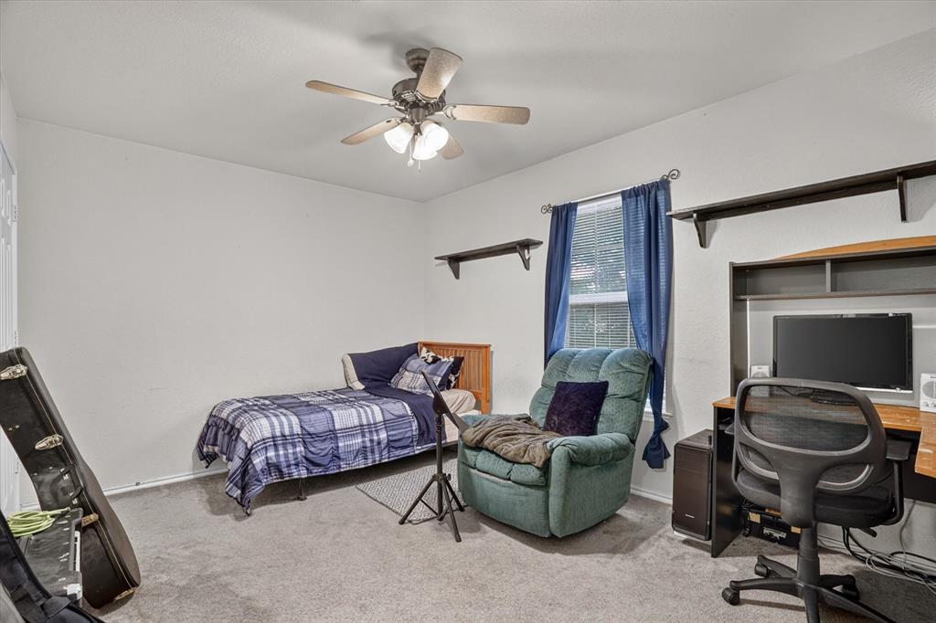 1654 Ranger Highway Weatherford, TX 76088 - Photo 17 of 31 Interior room featuring light gray wall paint and matching carpet flooring