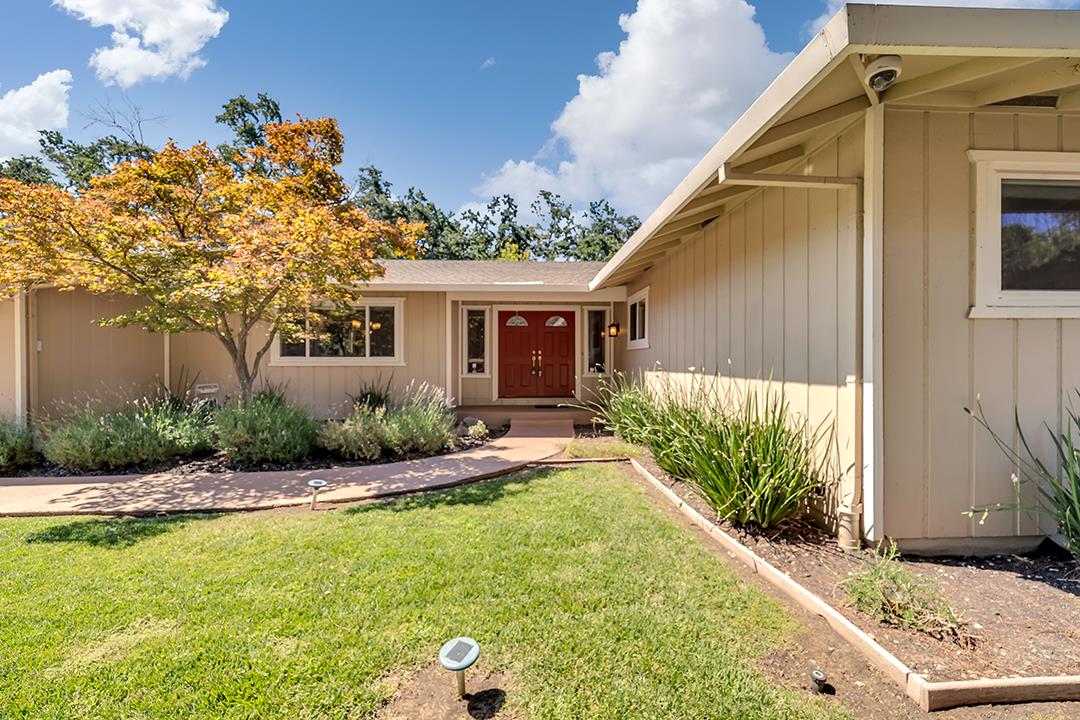 a front view of a house with garden