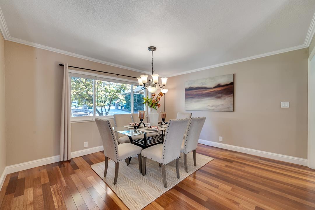 3151 Stone Valley Road Danville, CA 94526 - Photo 17 of 41 a dining room with furniture a chandelier and wooden floor