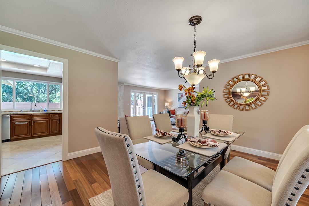 3151 Stone Valley Road Danville, CA 94526 - Photo 18 of 41 a view of a dining room with furniture a chandelier and wooden floor
