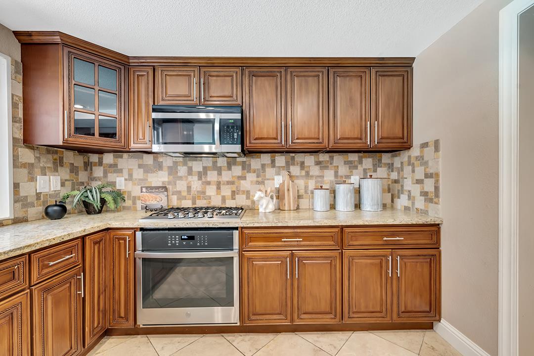 3151 Stone Valley Road Danville, CA 94526 - Photo 20 of 41 a kitchen with stainless steel appliances granite countertop a sink stove and cabinets