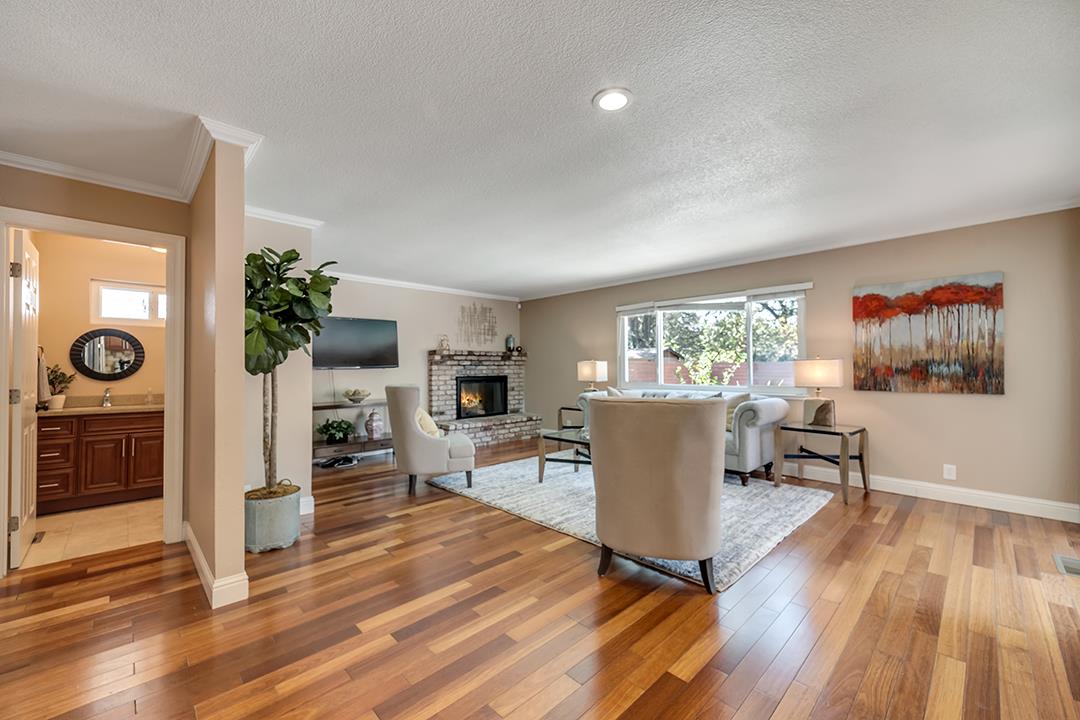 3151 Stone Valley Road Danville, CA 94526 - Photo 21 of 41 a living room with furniture a flat screen tv and wooden floor