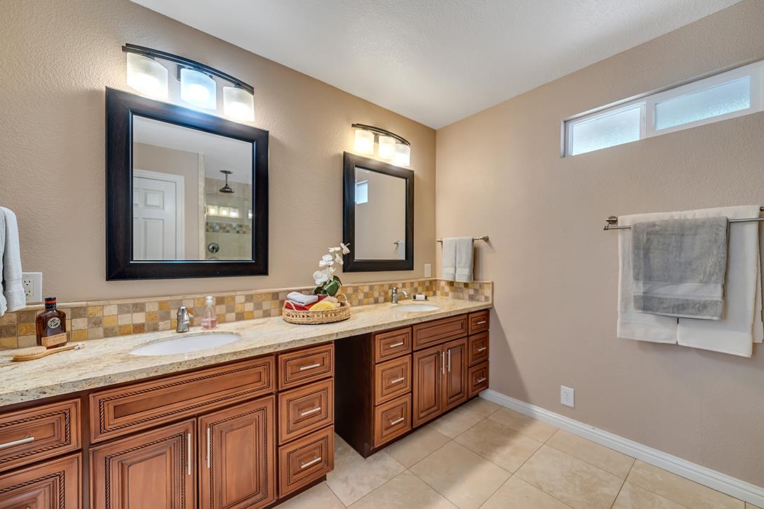 3151 Stone Valley Road Danville, CA 94526 - Photo 29 of 41 a bathroom with a double vanity sink and a mirror