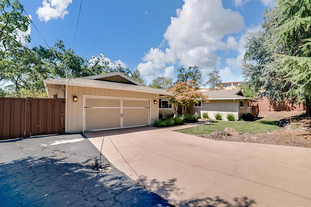 3151 Stone Valley Road Danville, CA 94526 - Photo 3 of 41 a front view of a house with a yard and garage