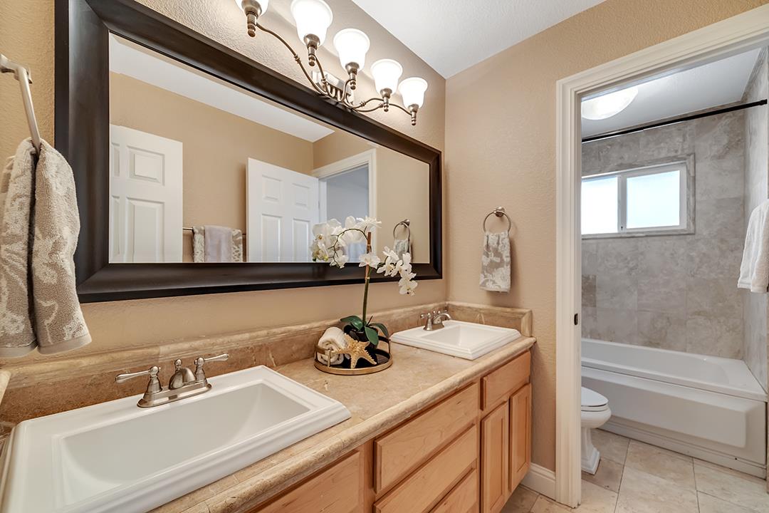 3151 Stone Valley Road Danville, CA 94526 - Photo 31 of 41 a bathroom with a sink double vanity and a mirror