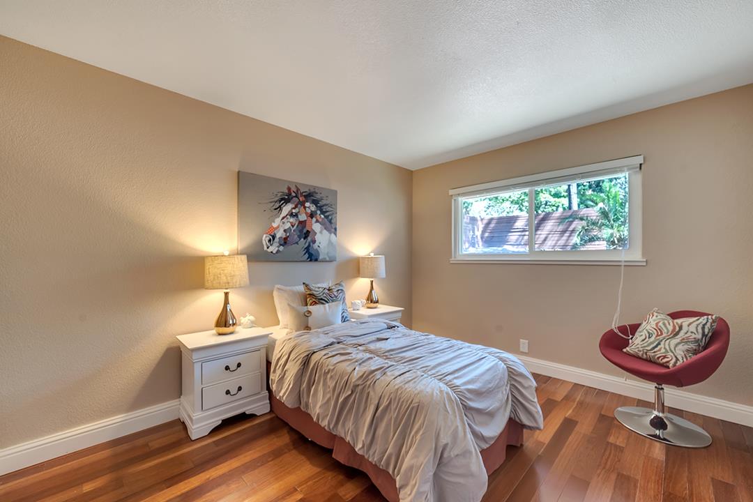 3151 Stone Valley Road Danville, CA 94526 - Photo 35 of 41 a bedroom with a bed and a chandelier