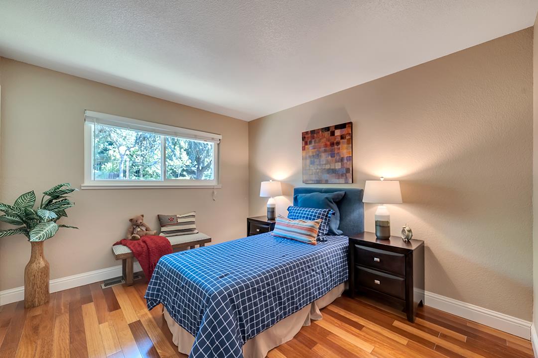 3151 Stone Valley Road Danville, CA 94526 - Photo 36 of 41 a bedroom with a bed and wooden floor