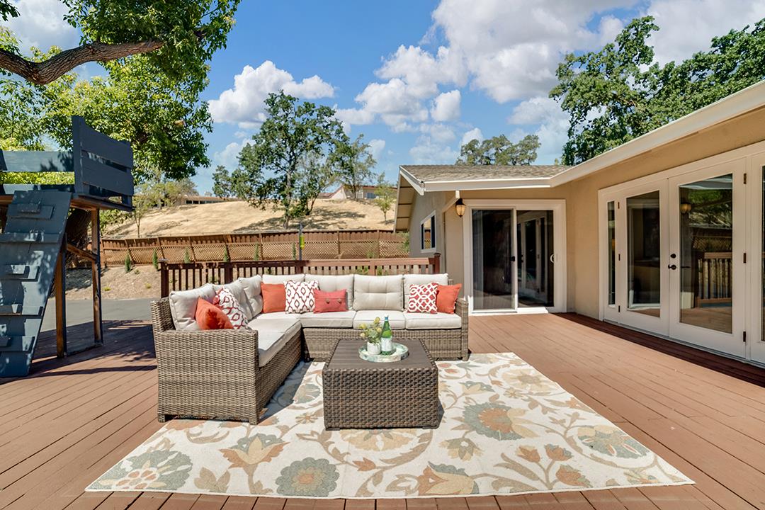 3151 Stone Valley Road Danville, CA 94526 - Photo 10 of 41 a view of a patio with table and chairs potted plants with wooden floor and fence