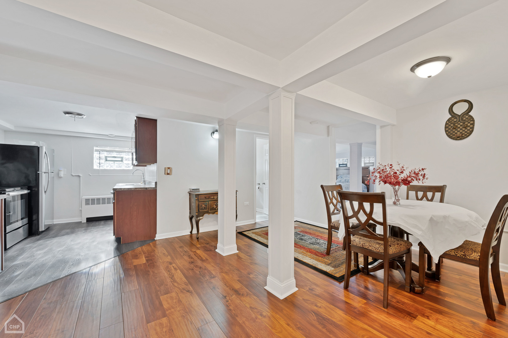 8912 Forestview Road Evanston, IL 60203 - Photo 12 of 31 a dining room with furniture and wooden floor