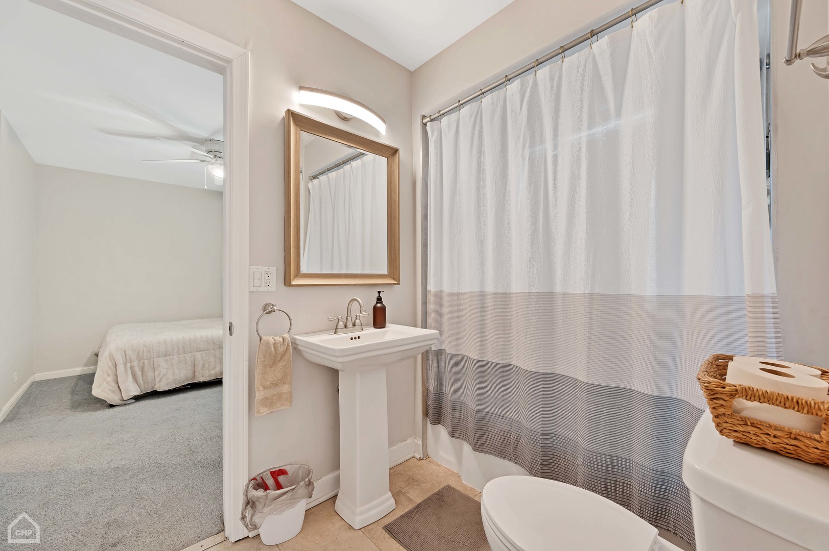 8912 Forestview Road Evanston, IL 60203 - Photo 15 of 31 a bathroom with a sink toilet and shower