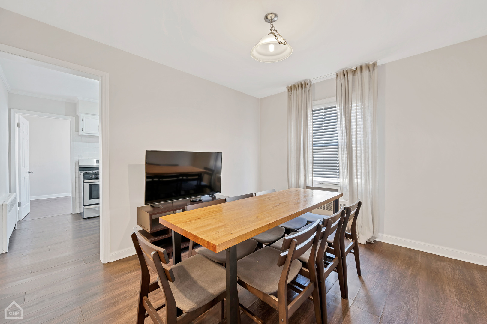 8912 Forestview Road Evanston, IL 60203 - Photo 20 of 31 a view of a dining room with furniture and wooden floor