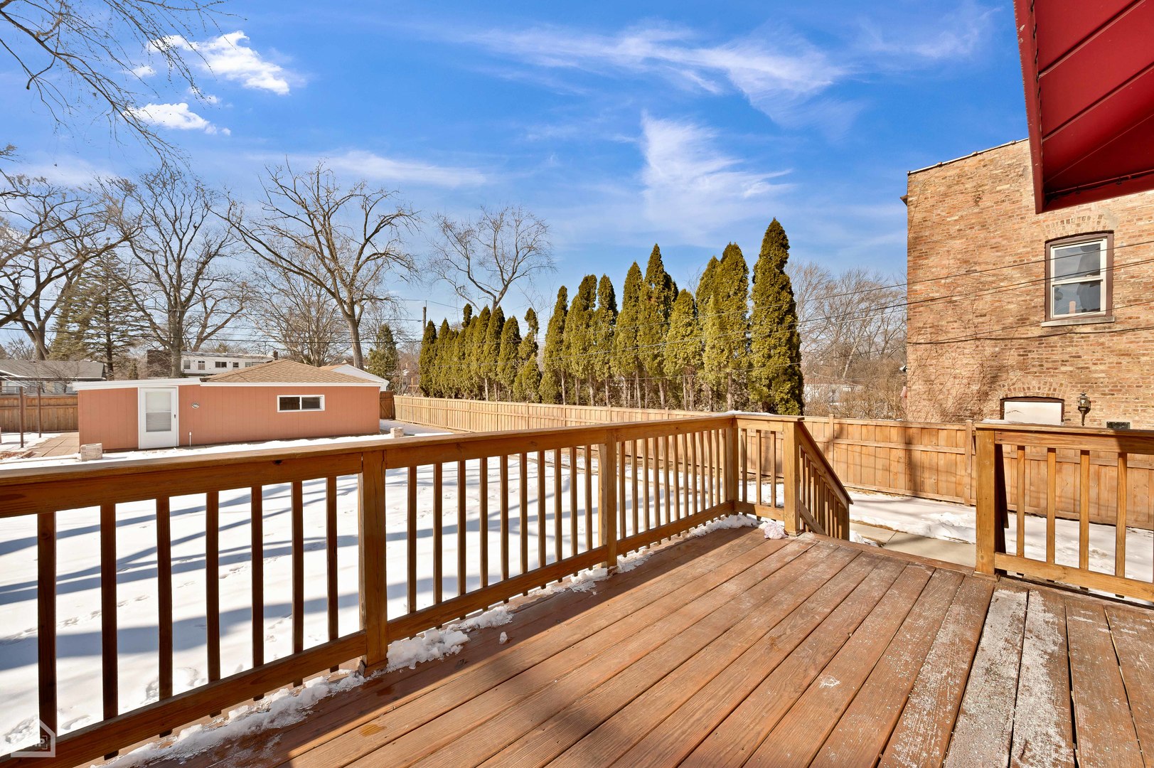 8912 Forestview Road Evanston, IL 60203 - Photo 26 of 31 a view of a balcony with wooden floor and fence