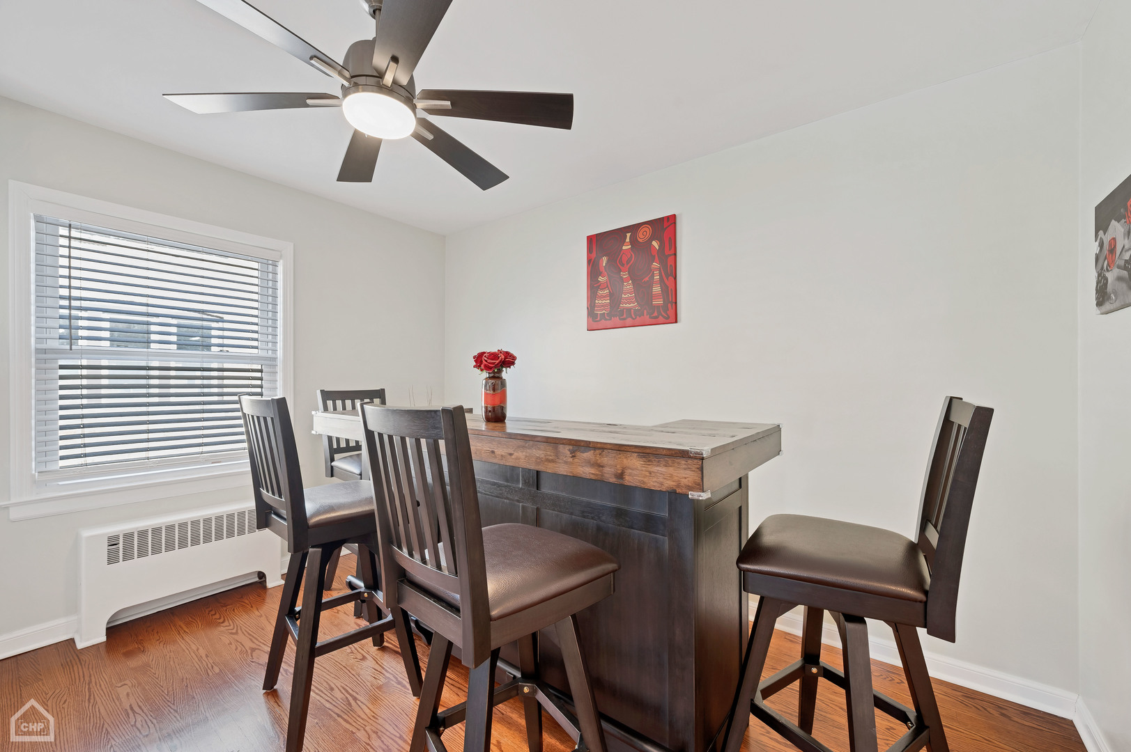 8912 Forestview Road Evanston, IL 60203 - Photo 6 of 31 a view of a dining room with furniture and wooden floor