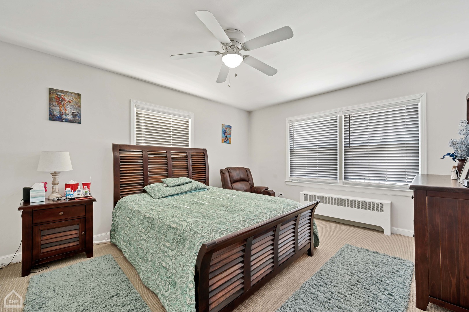 8912 Forestview Road Evanston, IL 60203 - Photo 7 of 31 a bed room with a bed and a chandelier