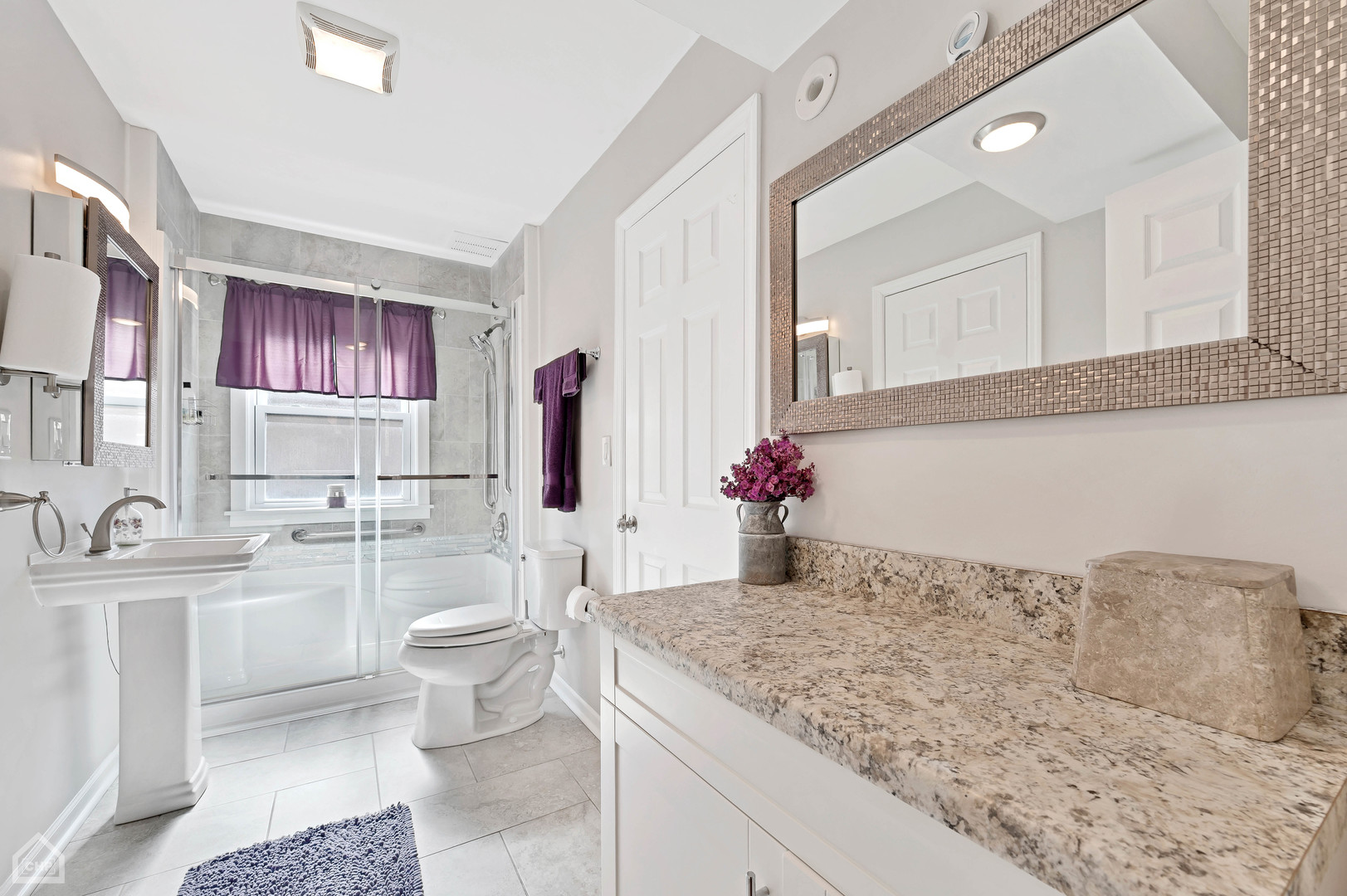 8912 Forestview Road Evanston, IL 60203 - Photo 9 of 31 a bathroom with a granite countertop sink and a mirror