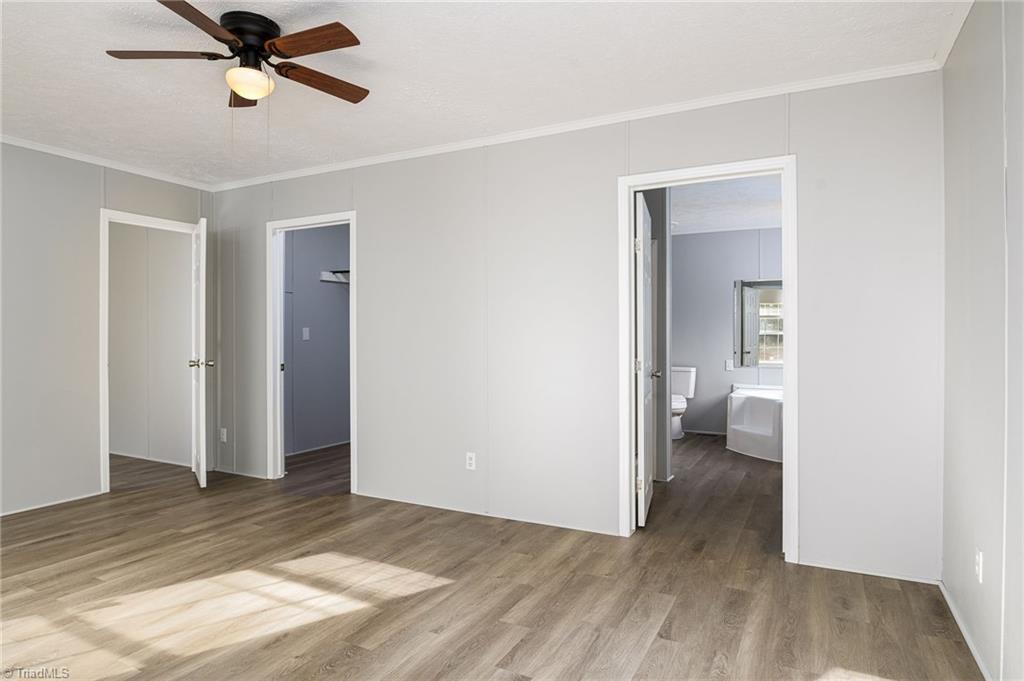 1591 Carson Road Pilot Mountain, NC 27041 - Photo 16 of 50 View of walk in closet and primary bathroom